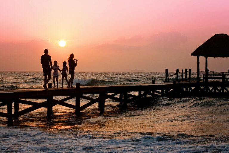 Family walking together on a dock at sunset, symbolizing long-term planning and togetherness